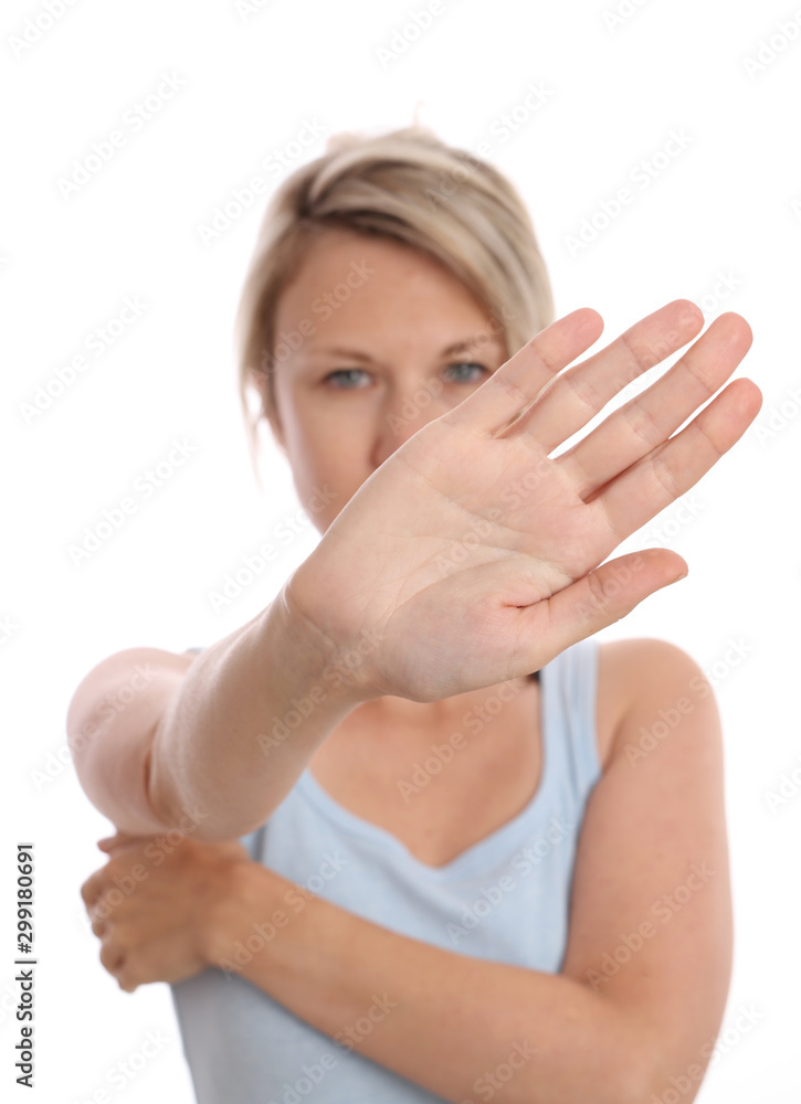 Woman showing stop / no gesture with her palm isolated on white background Woman showing stop / no gesture with her palm isolated on white background