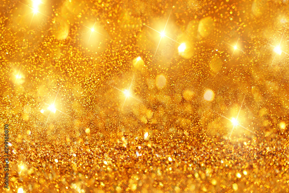 Obraz premium Golden bokeh and shiny stars holiday background.