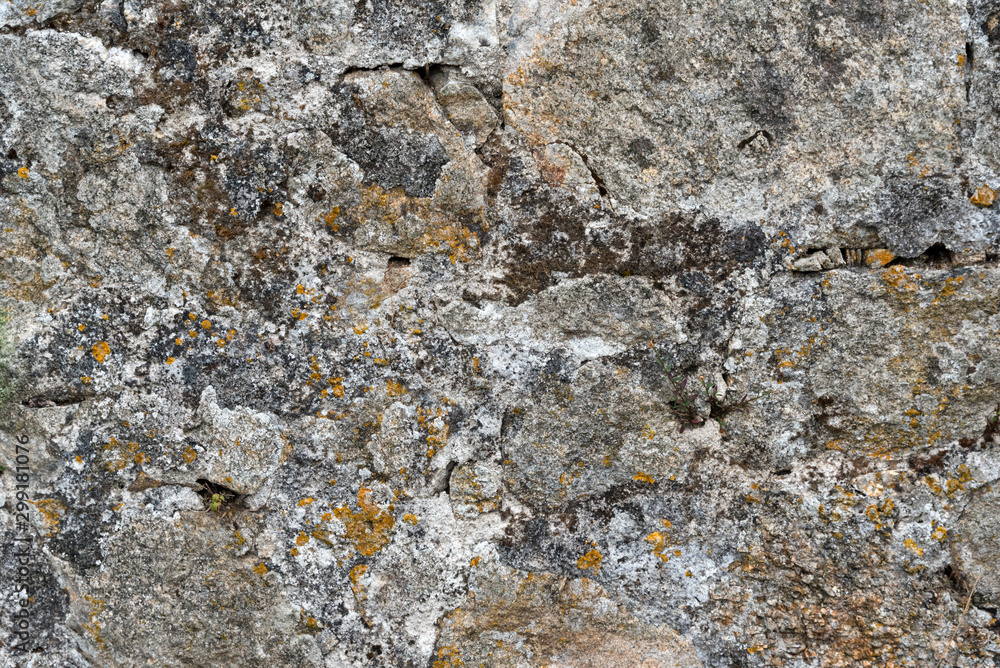 Texture of a stone wall. Old castle stone wall background. Wall made of wild stone. Natural background.