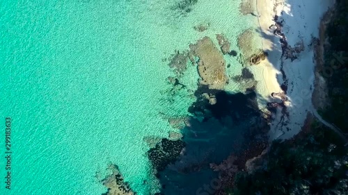 Aerial footage of a perfectly crystal clear blue turquoise water in a tropical paradise. Beautiful holiday destination scene with see through warm water photo