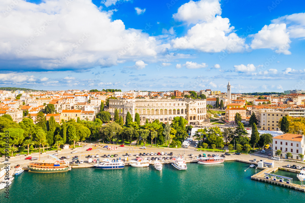 Croatia, city of Pula, ancient Roman arena, historic amphitheater and old town center from drone, aerial view