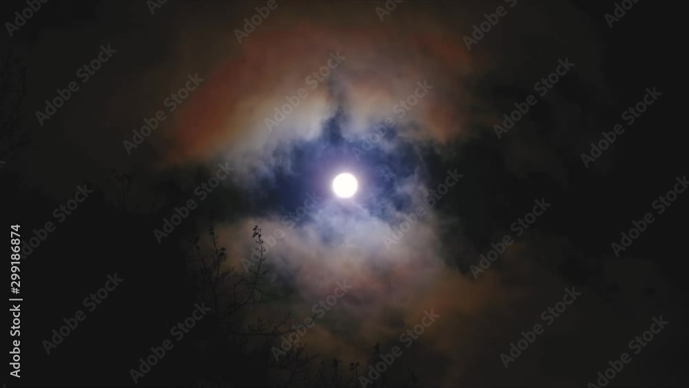 Full moon in the night sky, full moon, night sky, the motion of clouds in the night sky against the background of a bright moon, Clouds in the night sky against a bright moon