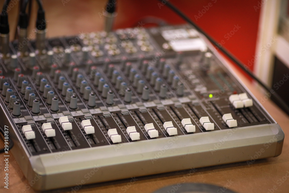 Shallow depth of field (selective focus) image with the controls on an audio mixer Shallow depth of field (selective focus) image with the controls on an audio mixer