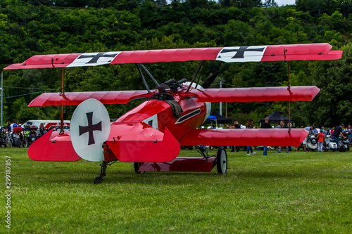 Fényképezés German, red triplane Fokker Dr-1 M replica on a meadow.