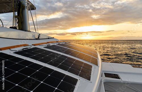 Принти на полотні Solar powered catamaran at sunset, fully sustainable and powered by solar energy, charging batteries aboard a sailboat, vessel in ocean waters, nobody