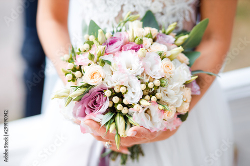 White bridal bouquet of roses and peonies. Wedding day. 