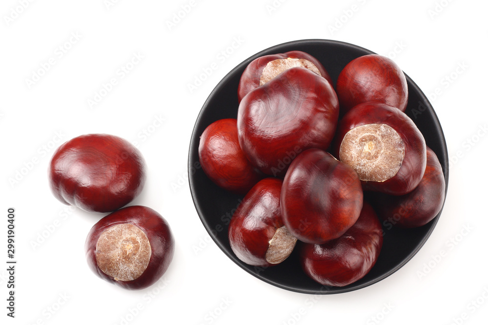 chestnuts in a black plate isolated on white background. top view chestnuts in a black plate isolated on white background. top view