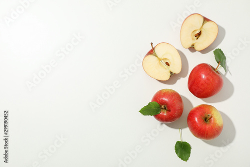 Flat lay with red apples on white background, space for text photo