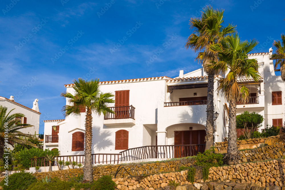 Fototapeta premium Traditional Spanish architecture with white summer villas on the island of Menorca. Spain