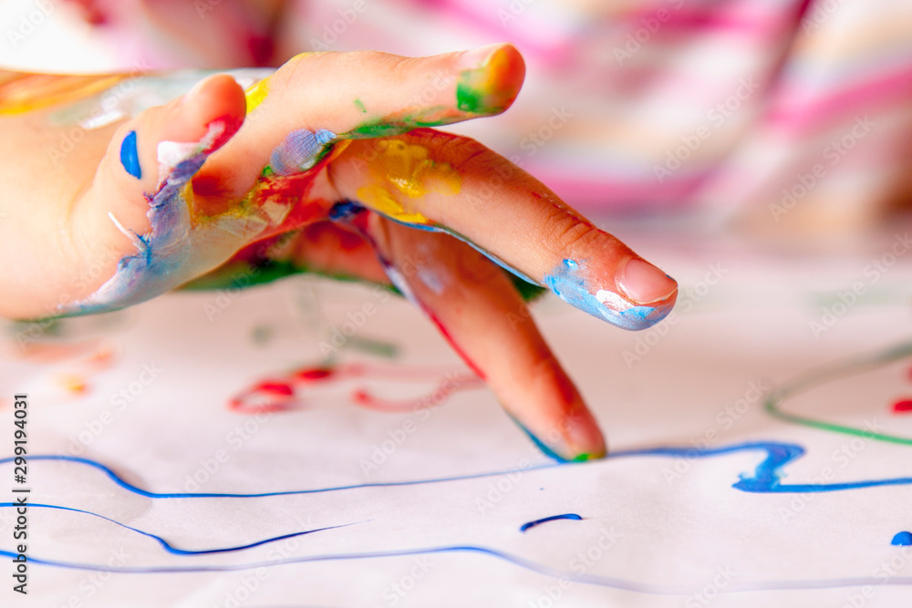 Close up young girl painting with colorful hands. Art,  creativity and painting concept. - obrazy, fototapety, plakaty 