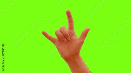 Female Hand Raises Slowly and Gestures the I Love You Sign from Bottom to Center of the Screen with a Green Screen Background. photo