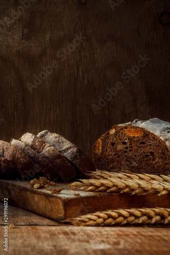 Wallpaper Mural Freshly baked wheat bread, homemade cakes, still life with bread, crisp loaf of bread, still life on a rustic background, top view, rustic bread, roll, loaf. Torontodigital.ca