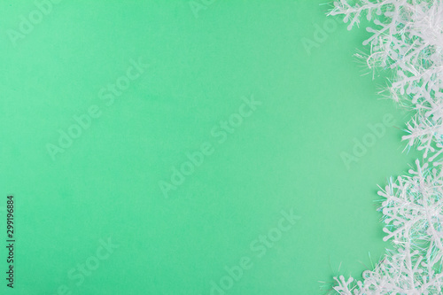 Wallpaper Mural Snowflakes on a mint green background. Winter Holiday festive greeting card with copy space for the text. Xmas flat lay concept. Torontodigital.ca