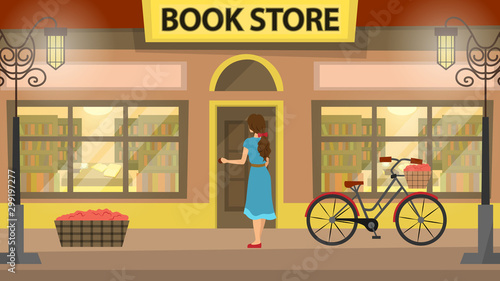 Bookshop, bookstore building facade with girl. A lot of books on the shelves. Beautiful bicycle near the building.