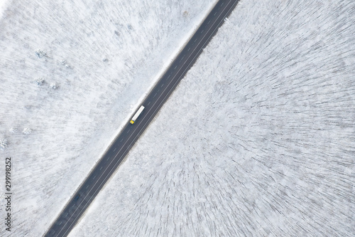 Aerial view of Winter forest and the road. Winter landscape
