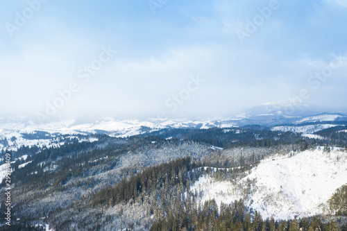 Aerial view of Winter forest and the road. Winter landscape