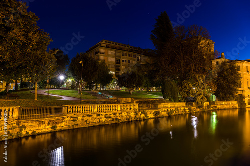 View on Sant Andrea gardens Giardinetti Sant Andrea a park in the city center across the Sile river with blue sky at night Treviso Italy