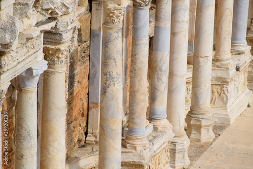 Columns on the stage of the amphitheater. Ancient antique amphitheater in city of Hierapolis in Turkey.
