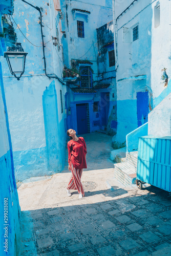 tourist in the blue city of morocco stands on the pavement © nelen.ru