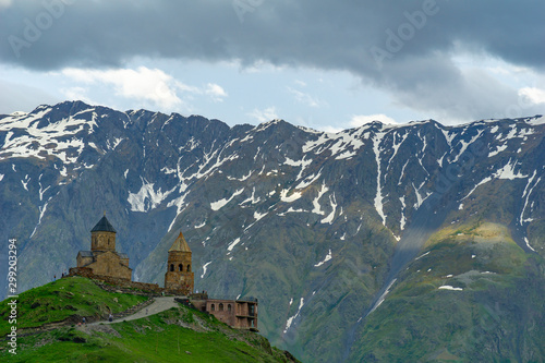 Gergeti Holy Trinity Church and Kazbegi mountain from Stepancminda village in Georgia © Yakup