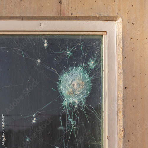 Картината върху платно Square Bullet holes in the window glass of a bulletproof bunker