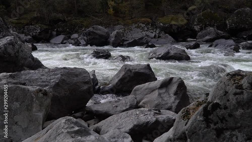 Scenic waterfall Uchar cascade view with currents and boulders. Altai mountains, Siberia, Russia. photo