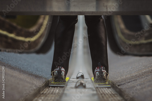 Detail view of a ski jumper on a large hill photo