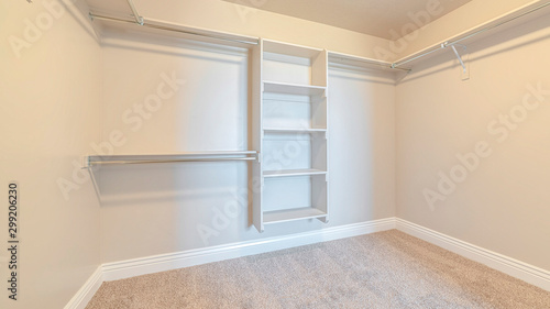 Panorama frame Interior of walk in closet with bare shelving