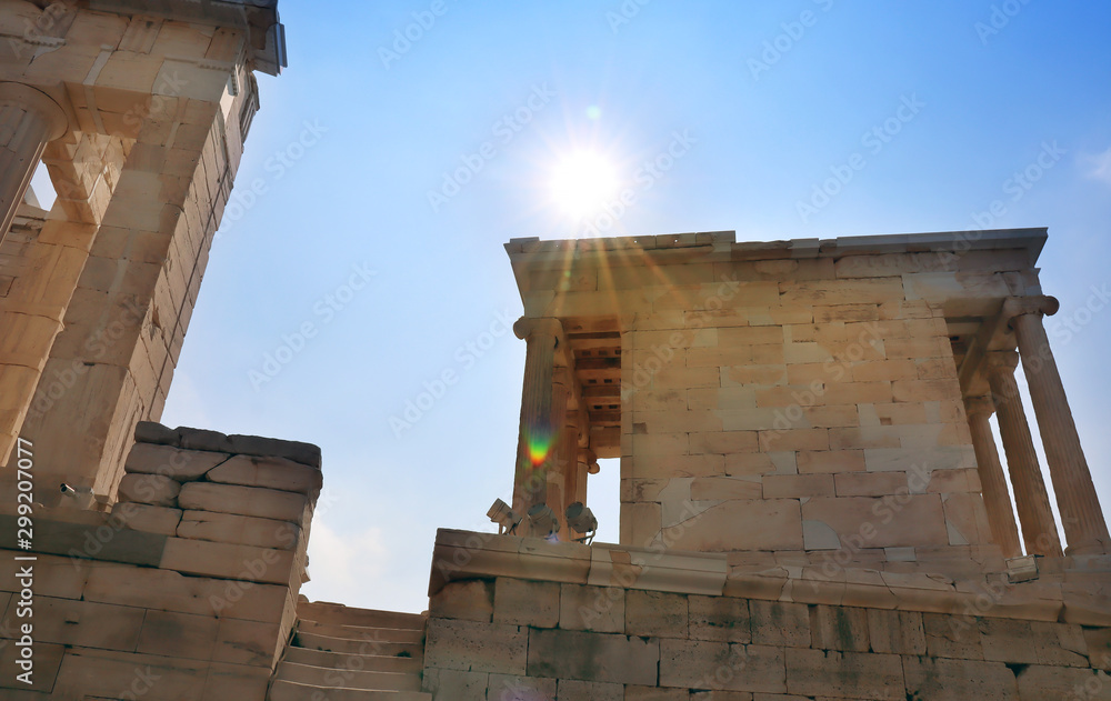 Sunbeams on the landmark of Acropolis in Athens, Greece.