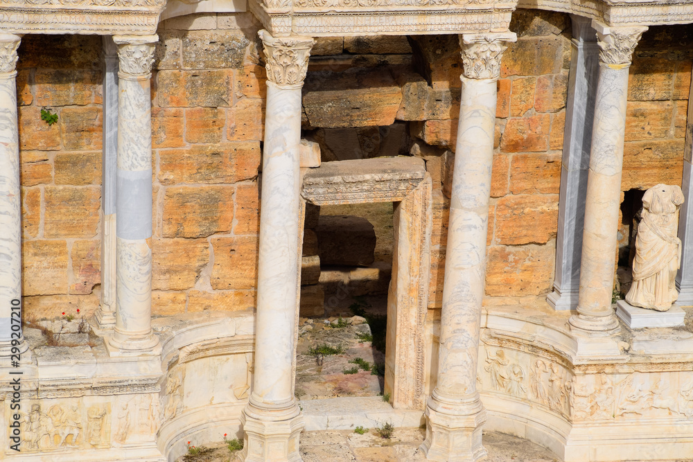 Marble statues at the columns of the amphitheater in Hierapolis, Turkey.