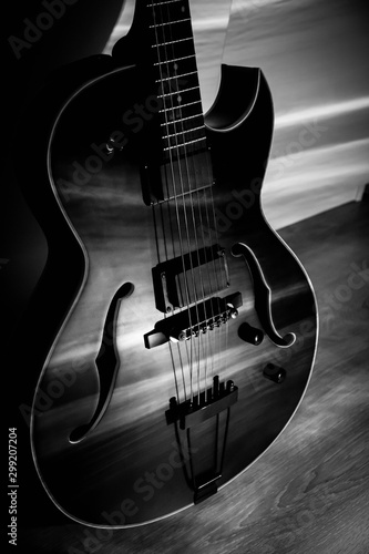 Canvas Print Black jazz archtop guitar with holes