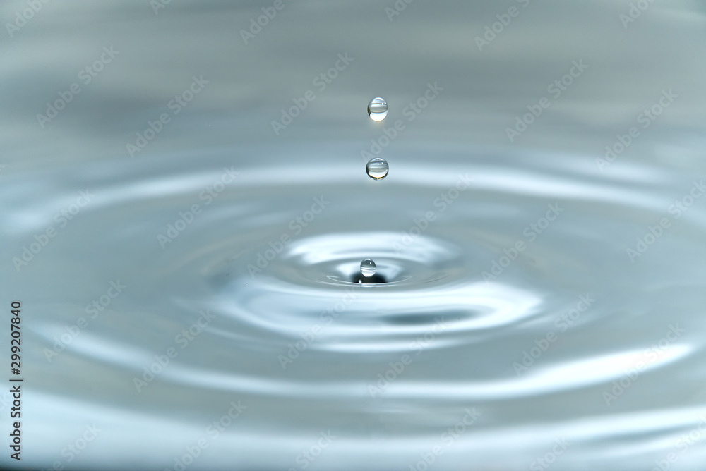 a drop of water hovering in the air before hitting a water surface, which will cause a beautiful splash, close-up photo a drop of water hovering in the air before hitting a water surface, which will cause a beautiful splash, close-up photo