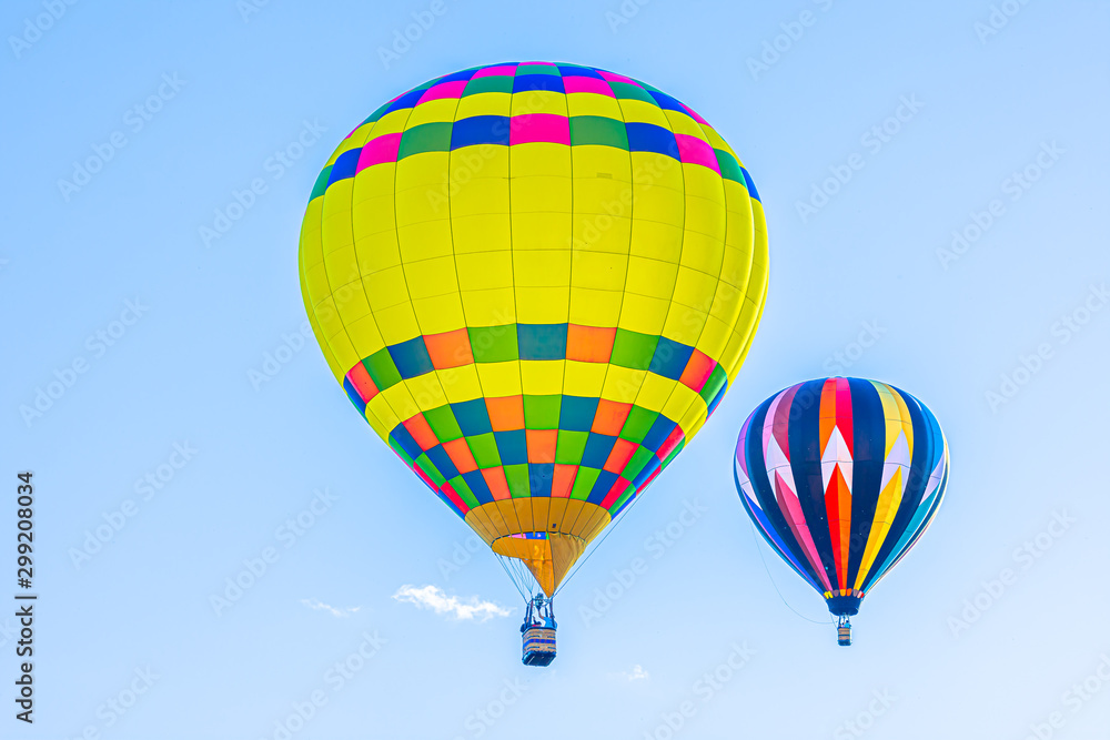 Naklejka premium Balloons with blue sky background launch at festival in North Carolina,USA.