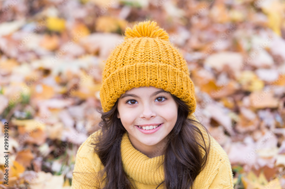 Smile of perfect beauty. Happy small child relax on autumn landscape. Natural beauty. Autumn beauty and fashion. Little beauty model in autumn style Smile of perfect beauty. Happy small child relax on autumn landscape. Natural beauty. Autumn beauty and fashion. Little beauty model in autumn style