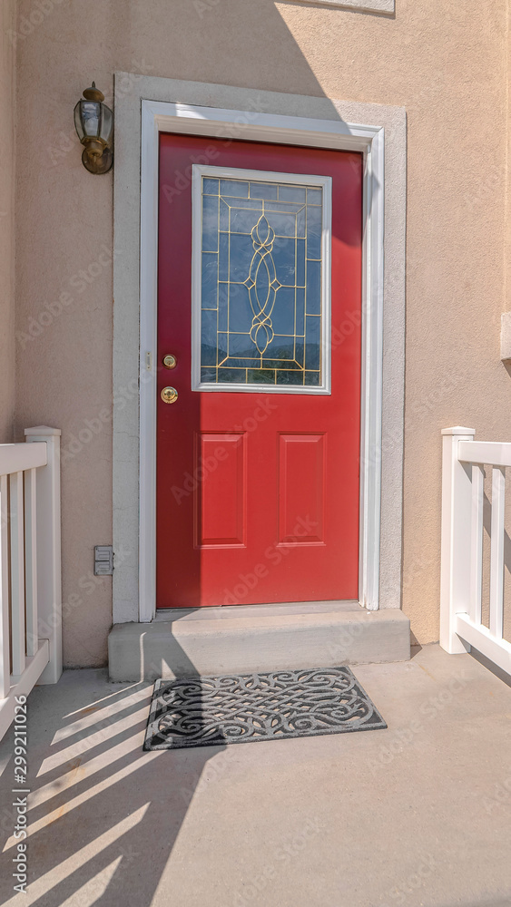 Vertical frame Red front door and steps of traditional home