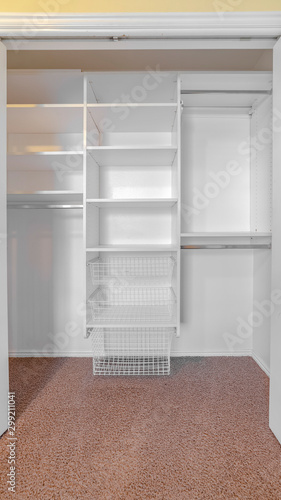 Vertical Open double door built in closet looking in