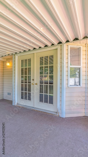 Vertical Veranda area of traditional home with covered spa