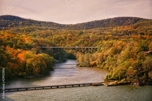 Landscape view of a bridge and mountains in early fall during the sunset at Bear Mountain State Park