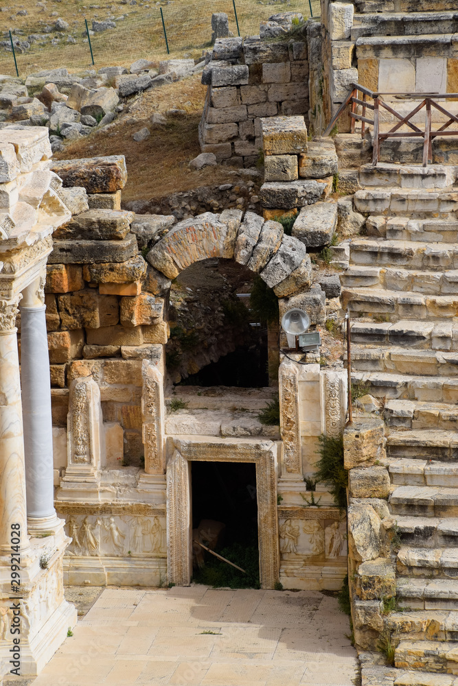 Side entrance to the stage of the amphitheater. Ancient antique amphitheater in city of Hierapolis in Turkey.