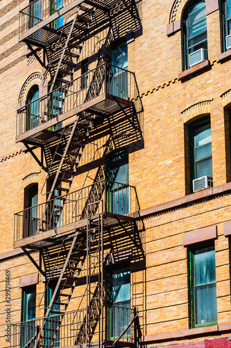 New York City East village building details with fire escapes. Background texture pattern of buildings.