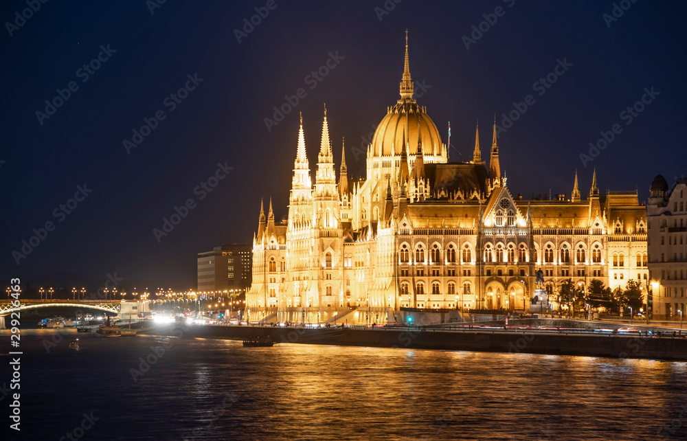 The Hungarian Parliament building along the Danube River at night