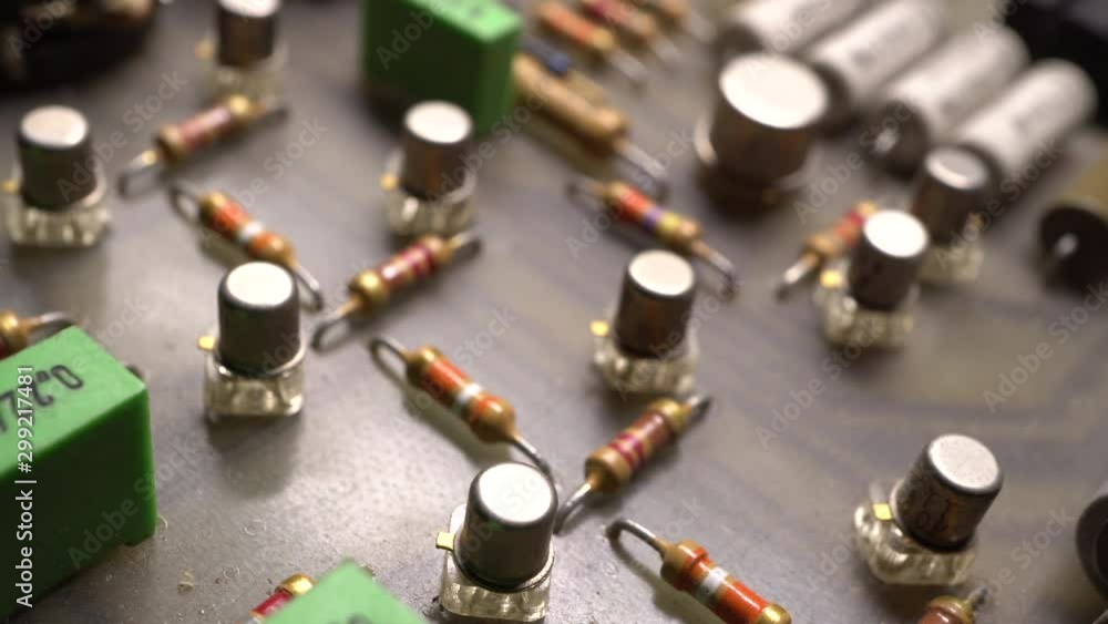 Circuit board with electronic components. Printed circuit board surface, close up. Electronic technology background. Dolly shot, sliding camera move and selective focus. Circuit board with electronic components. Printed circuit board surface, close up. Electronic technology background. Dolly shot, sliding camera move and selective focus.