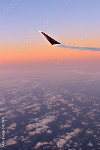 Photography Sky - OCTOBER 16, 2019:  Portrait sunrise view with clouds from Singapore Airlin