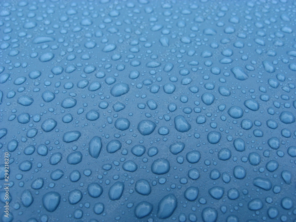 rain droplets on blue pool plastic