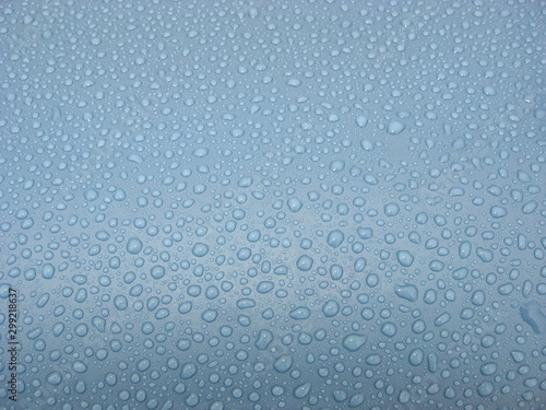 Pattern of water droplets on a plastic pool.