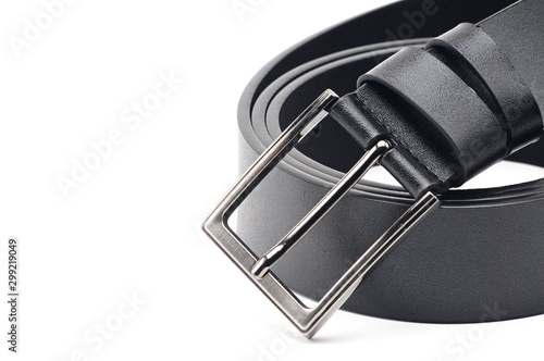 Black belt with a metal fastener on a white background photo