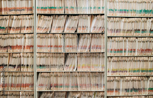 medical record charts on shelve sorted alphabetically photo