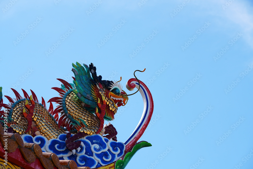 colorful dragon statue against blue sky colorful dragon statue against blue sky