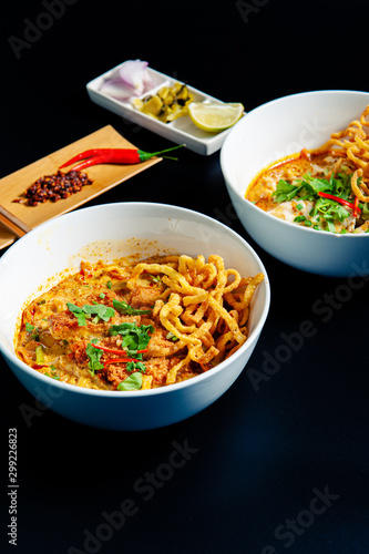 Khao Soi Chicken, a Thai food that is widely popular in the north along with the side dishes.