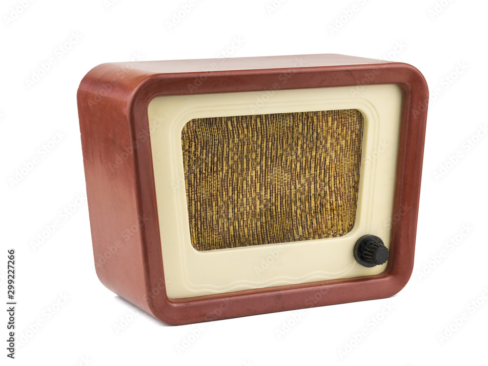 View from the left side of the old radio isolated on a white background. Radio engineering of the past time.